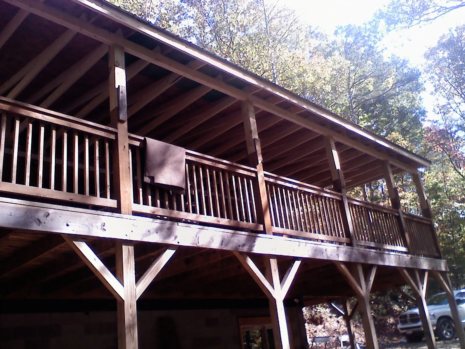 Timber framing under a new elevated porch and deck in Genesee